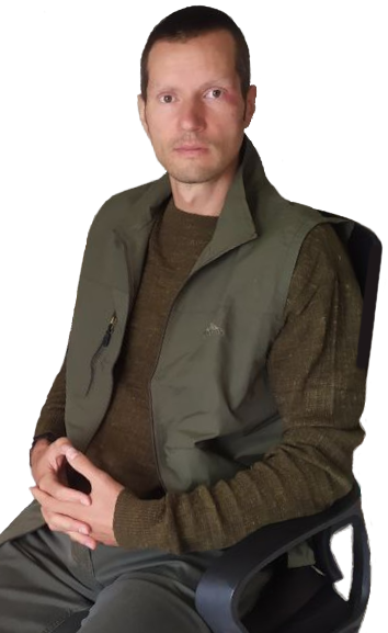 Portrait of David, sitting in an office chair.